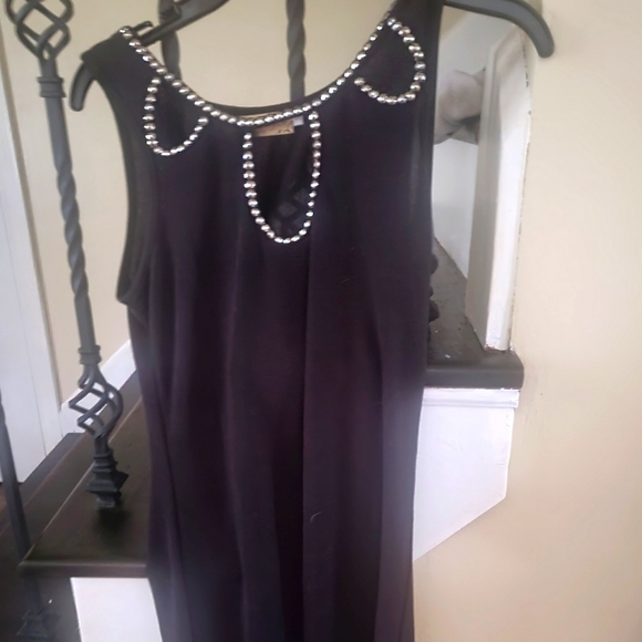 Black form fitting dress with beads on top and openings. Size small. - Picture 1 of 6